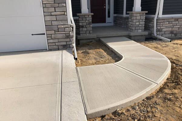 New concrete front entrance walkway and driveway